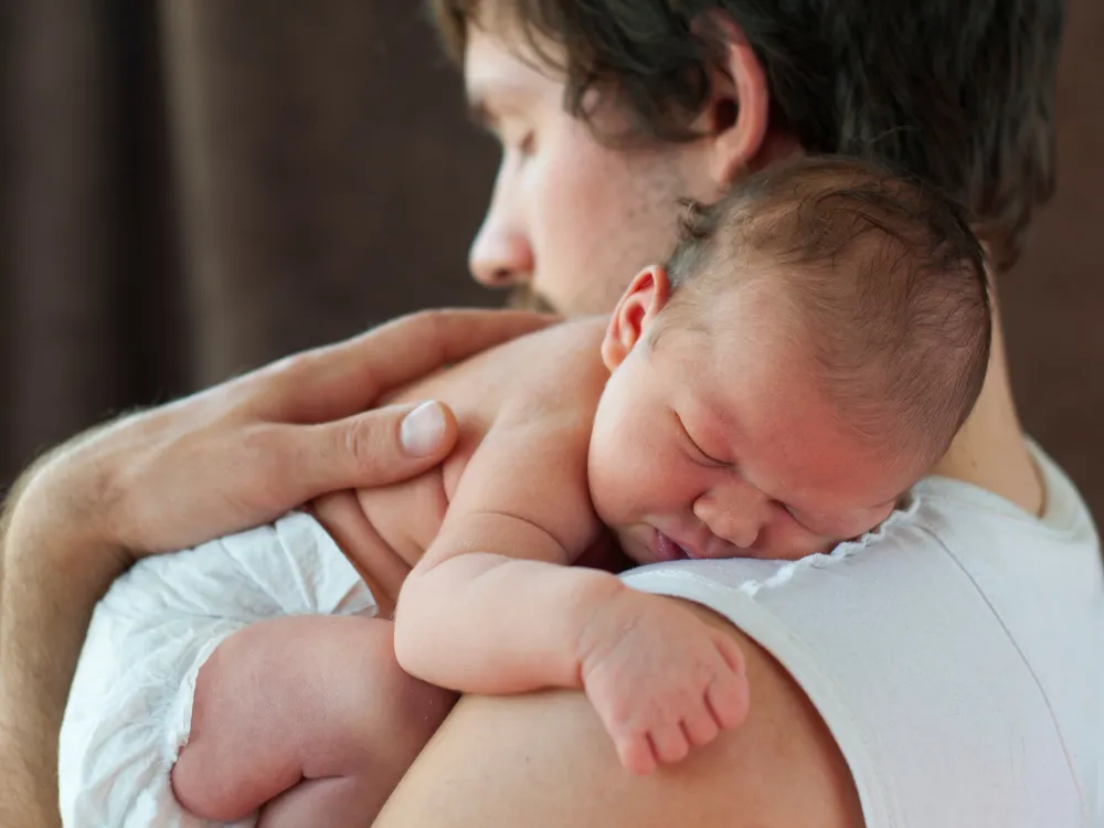 Dad holding baby