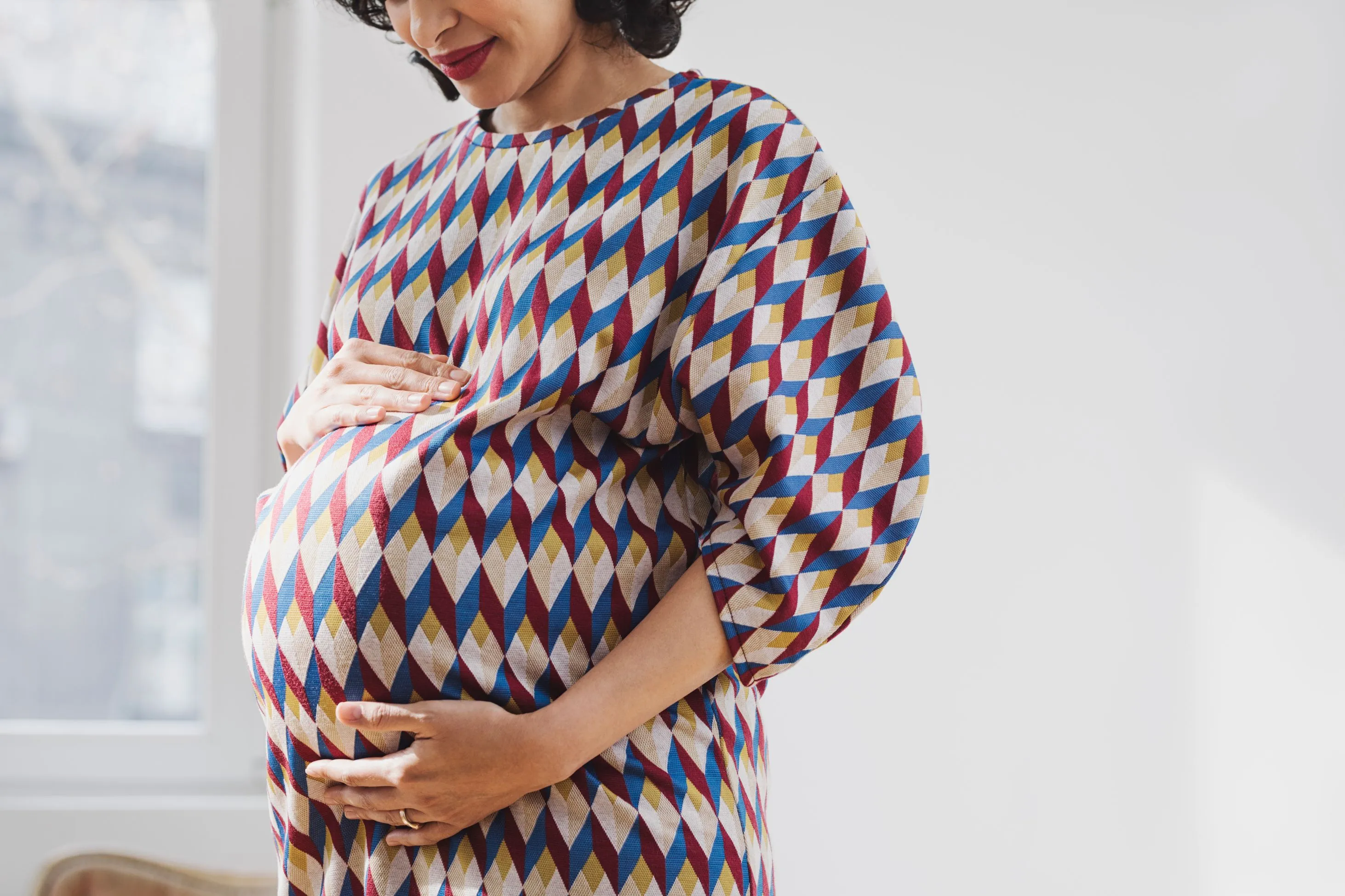 Expectant mother smiling